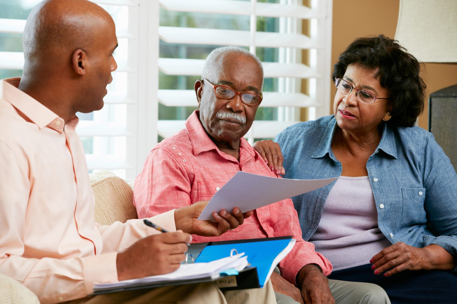An advisor reviewing documents with a couple during a guided Persynl session