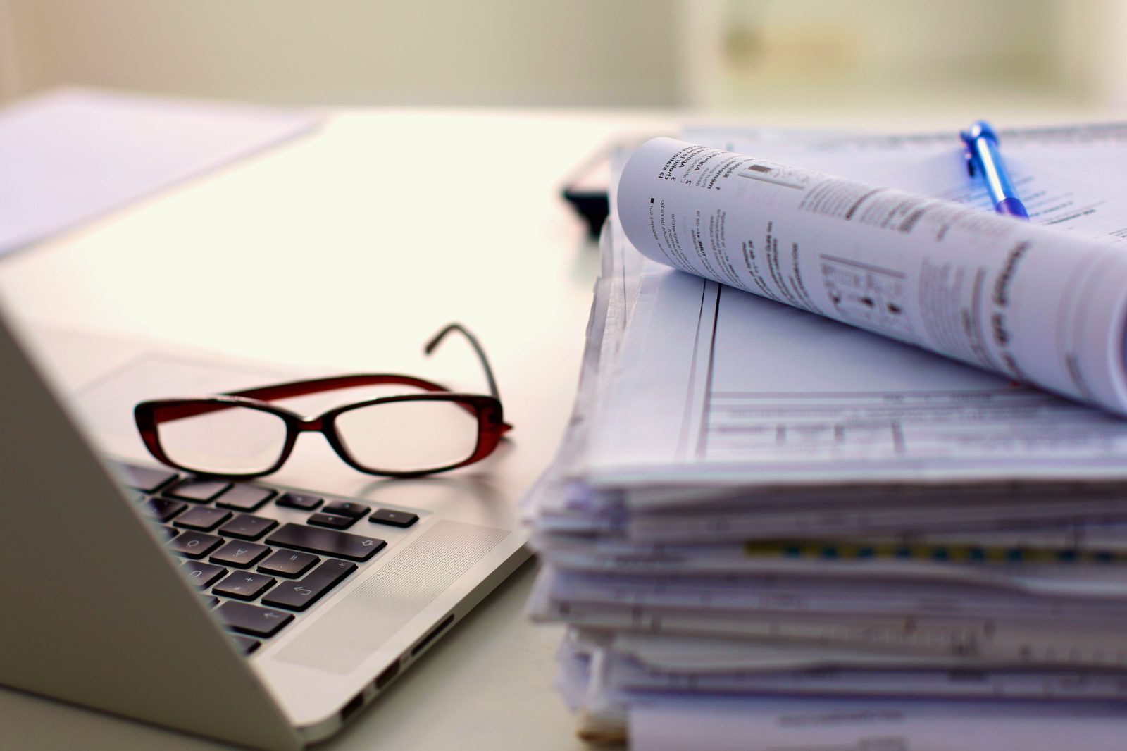 The documents and reading glasses that hold the details of a life